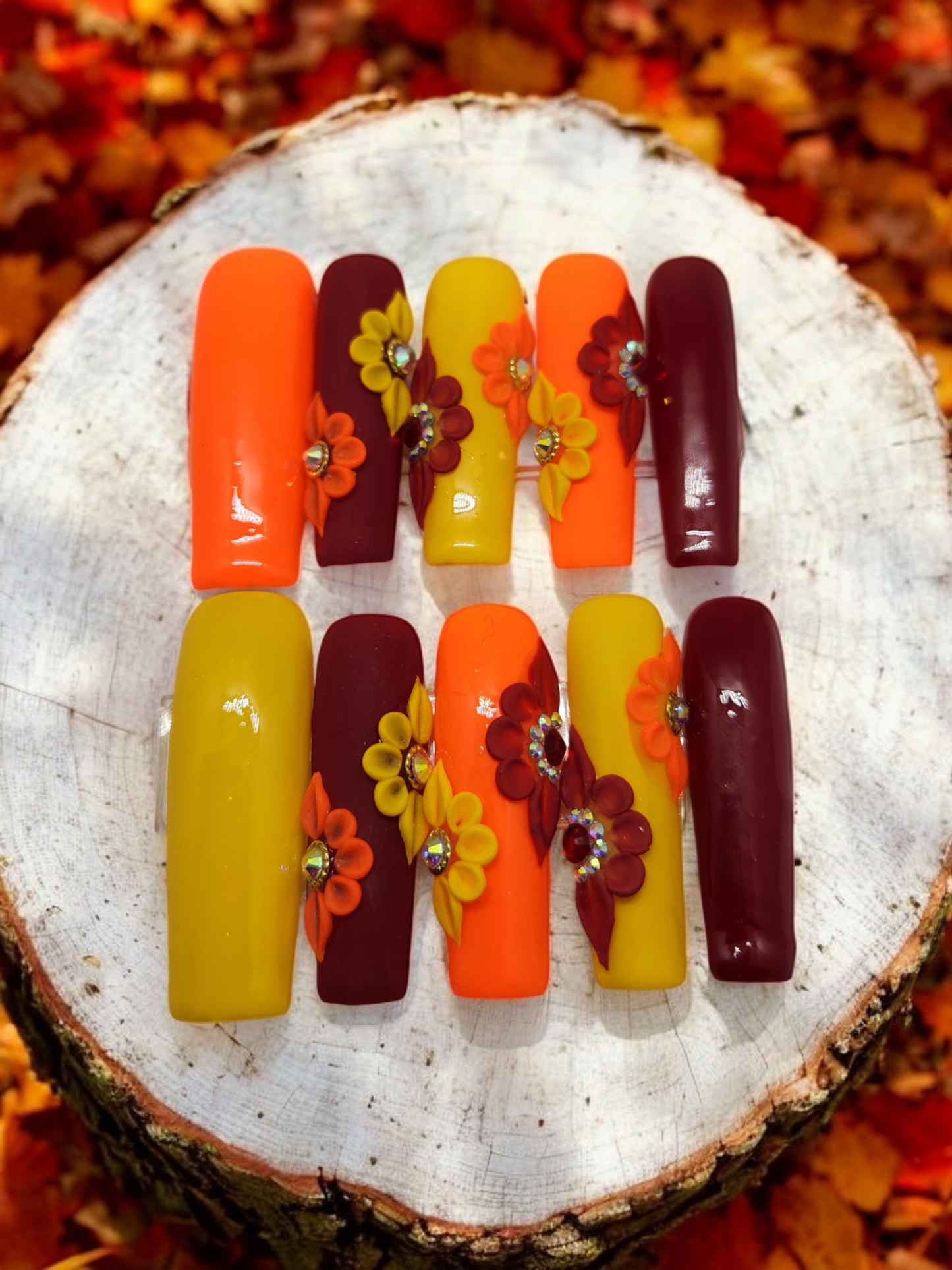 Orange, Red, and Yellow XL length Square press-on nails in size medium.