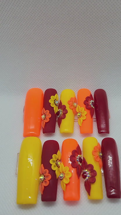Orange, Red, and Yellow XL length Square press-on nails in size medium.
